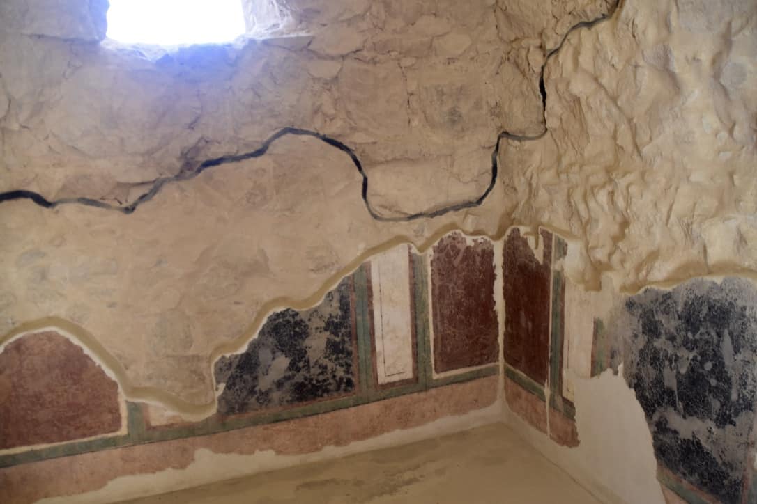The black line, excavated below and restored above