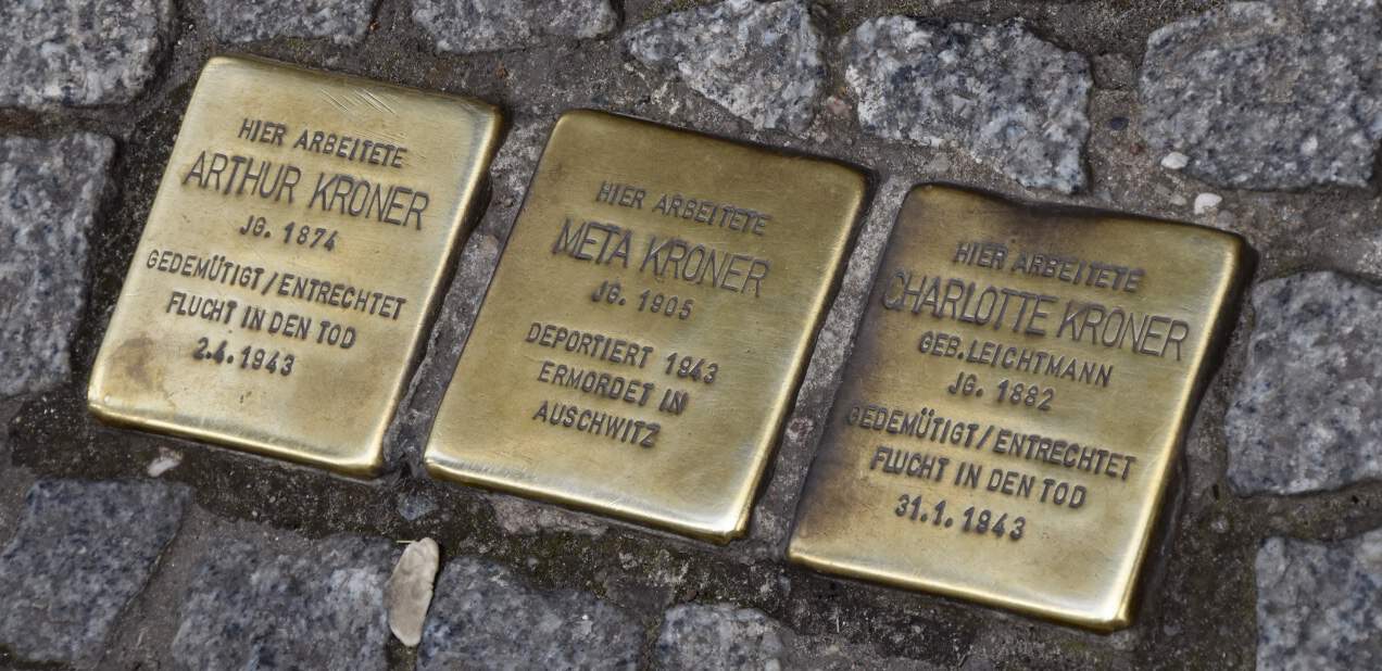Small plaques marking the homes of deported Jewish families