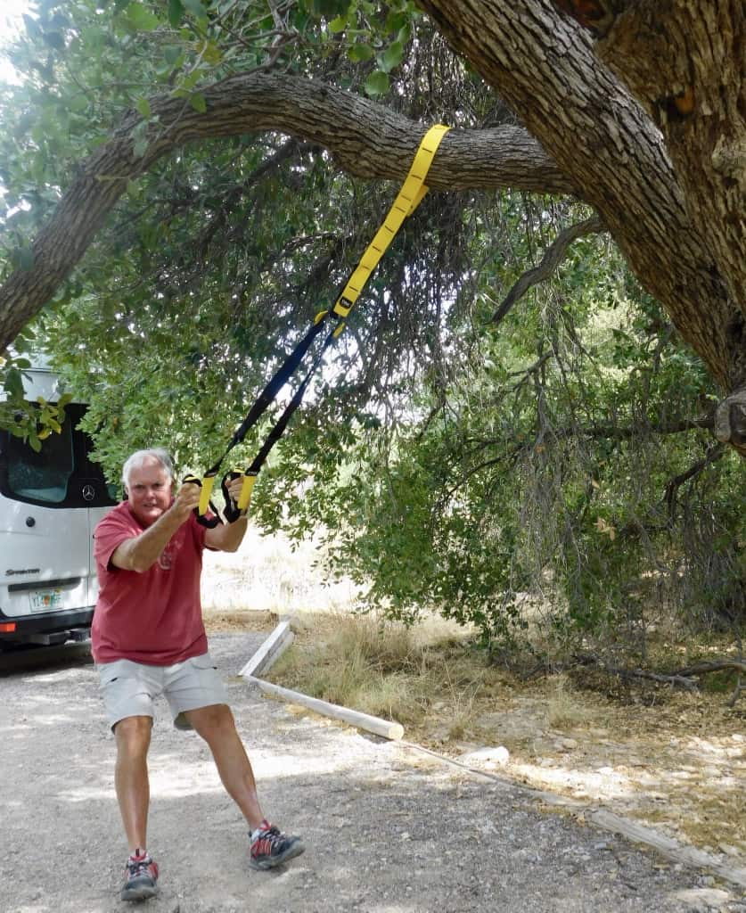 John doing his TRX workout at the campsite