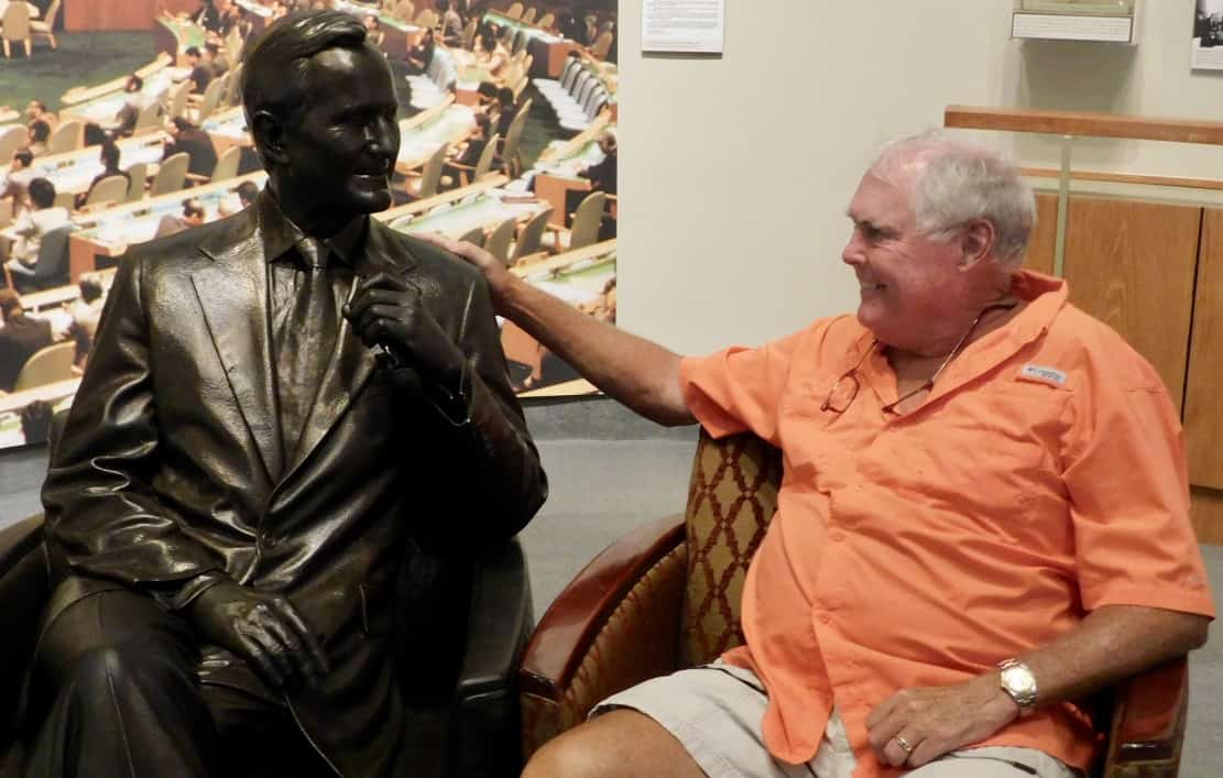 John with a figure of George H.W. Bush