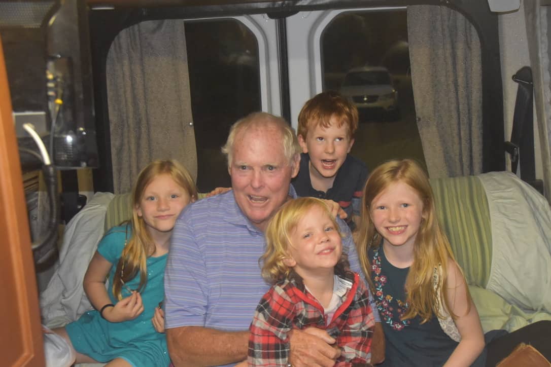 John with the grandchildren in the back of the RV