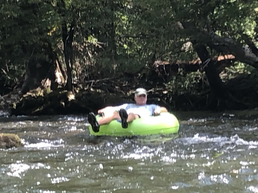 John tubing down the river