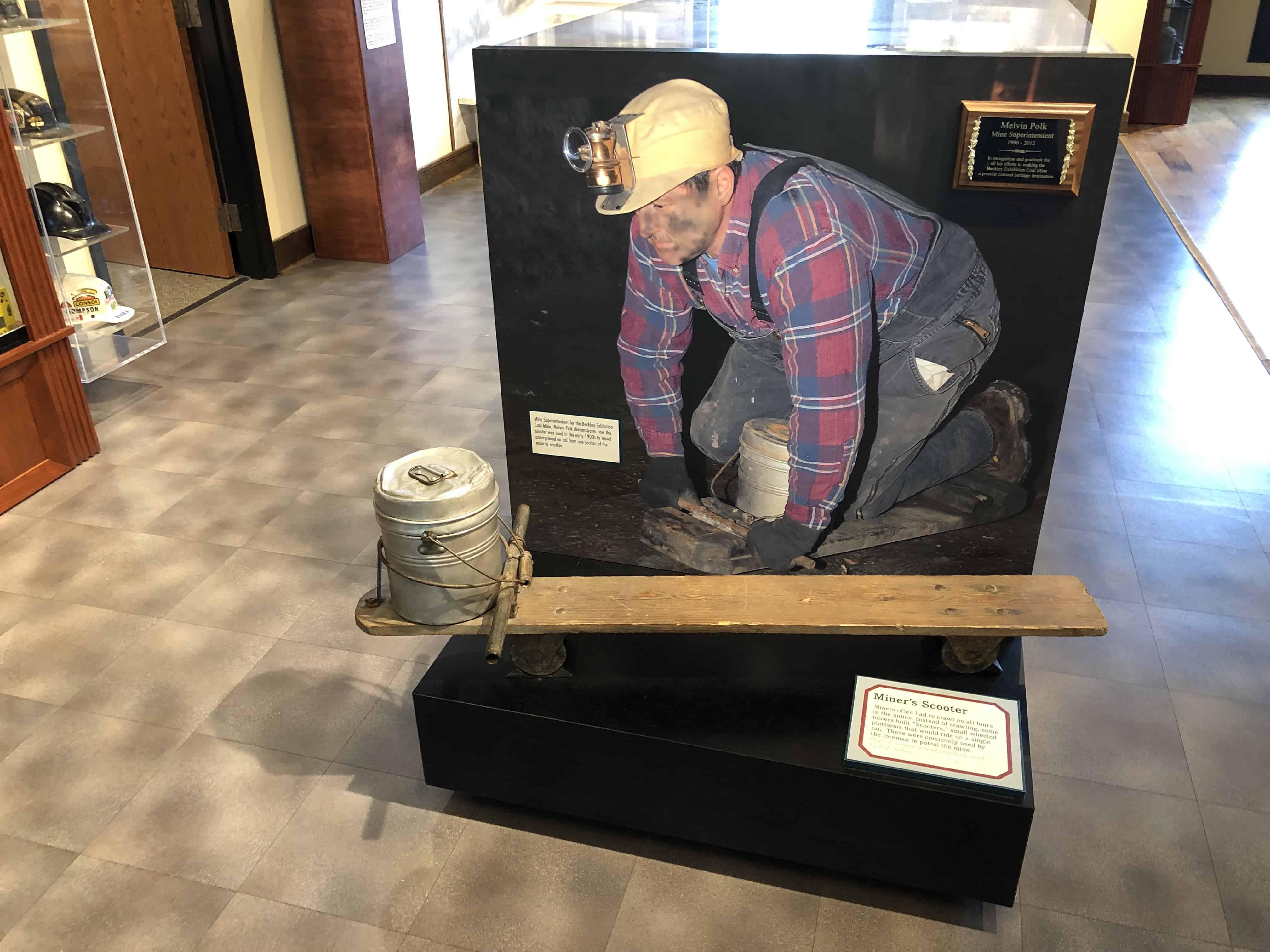 A miner's skateboard and lunch bucket
