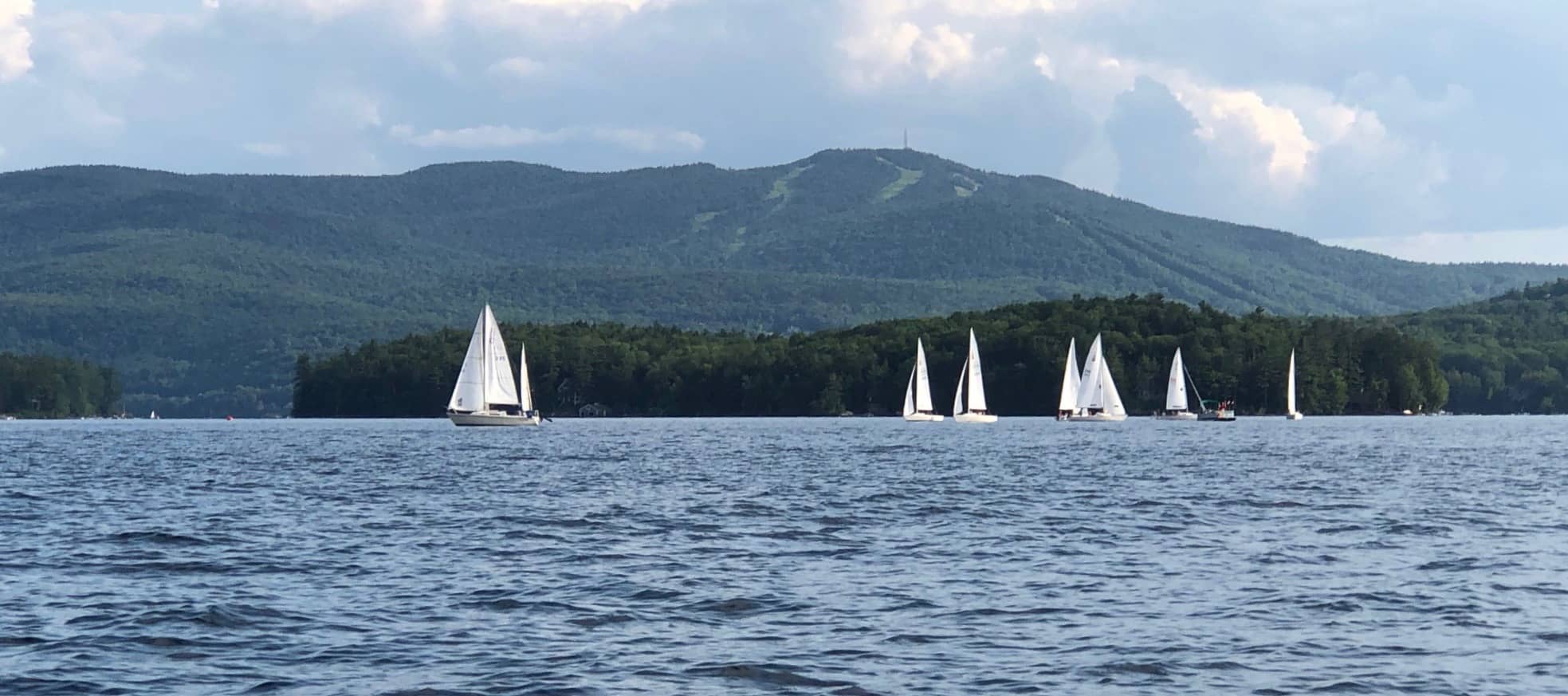 Sailboats against Sunapee Mountain