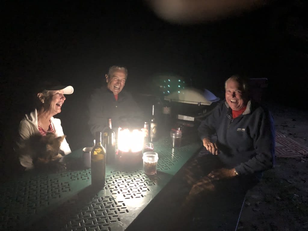 Sandie, Skip and John around the fire