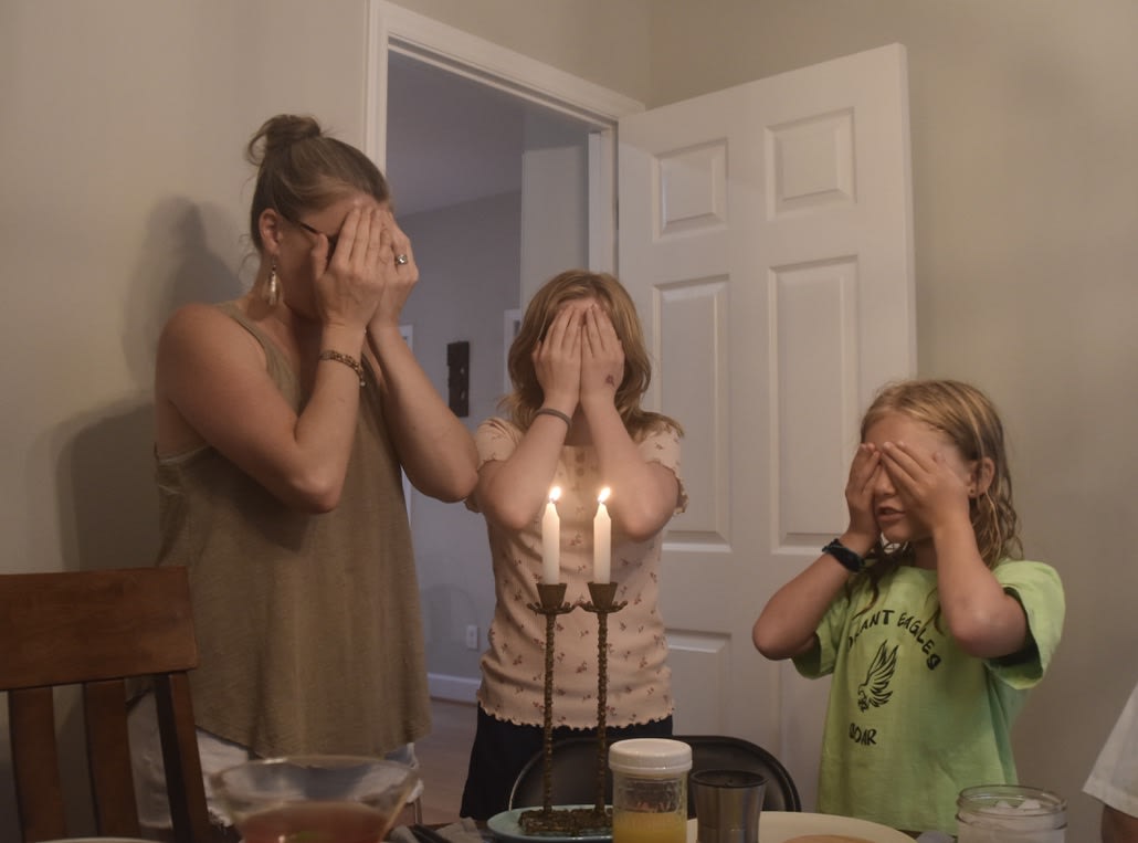 Amanda, Izzy, and Finley at Shabbat prayers