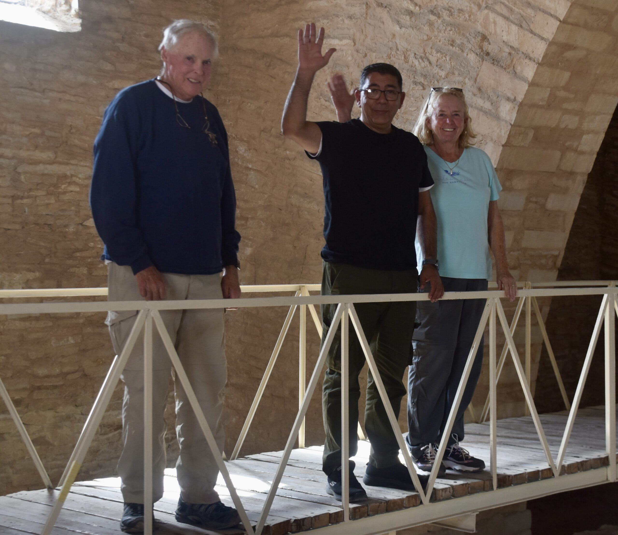 John, Hasan, and Janice watching the restoration