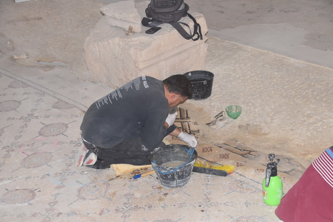 Restorers at work on the mosaics