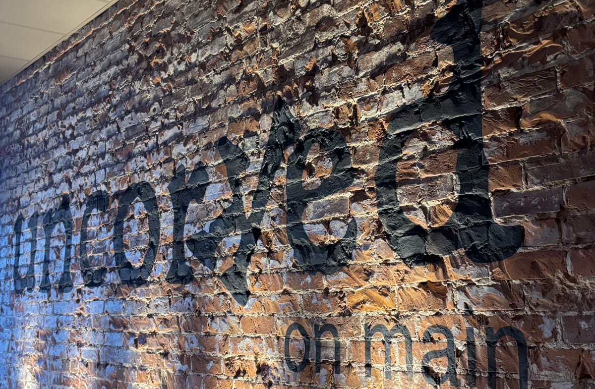 The exposed brick wall inside Uncorked on Main
