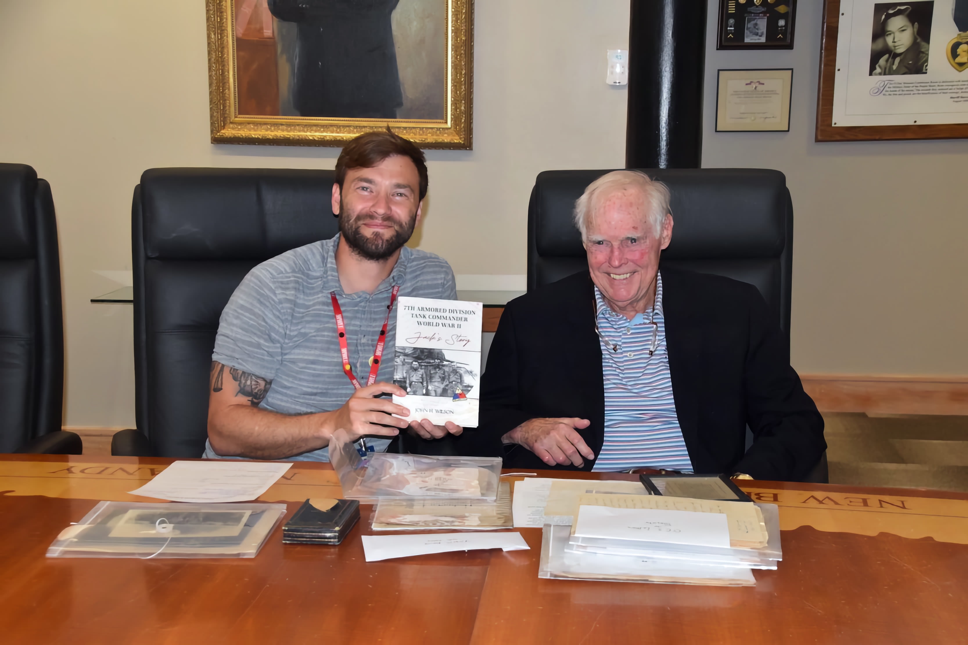 Curator Chase Tomlin with John