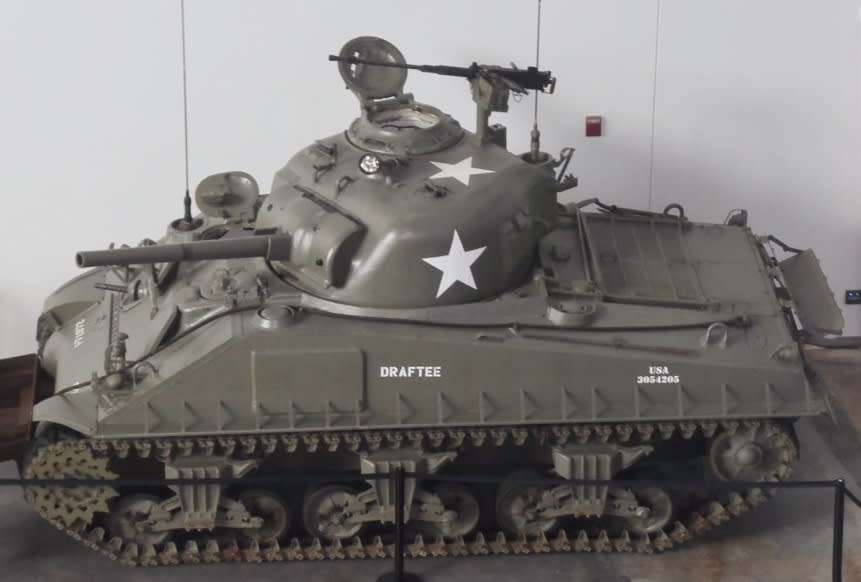 A restored Sherman tank, the kind John's father commanded