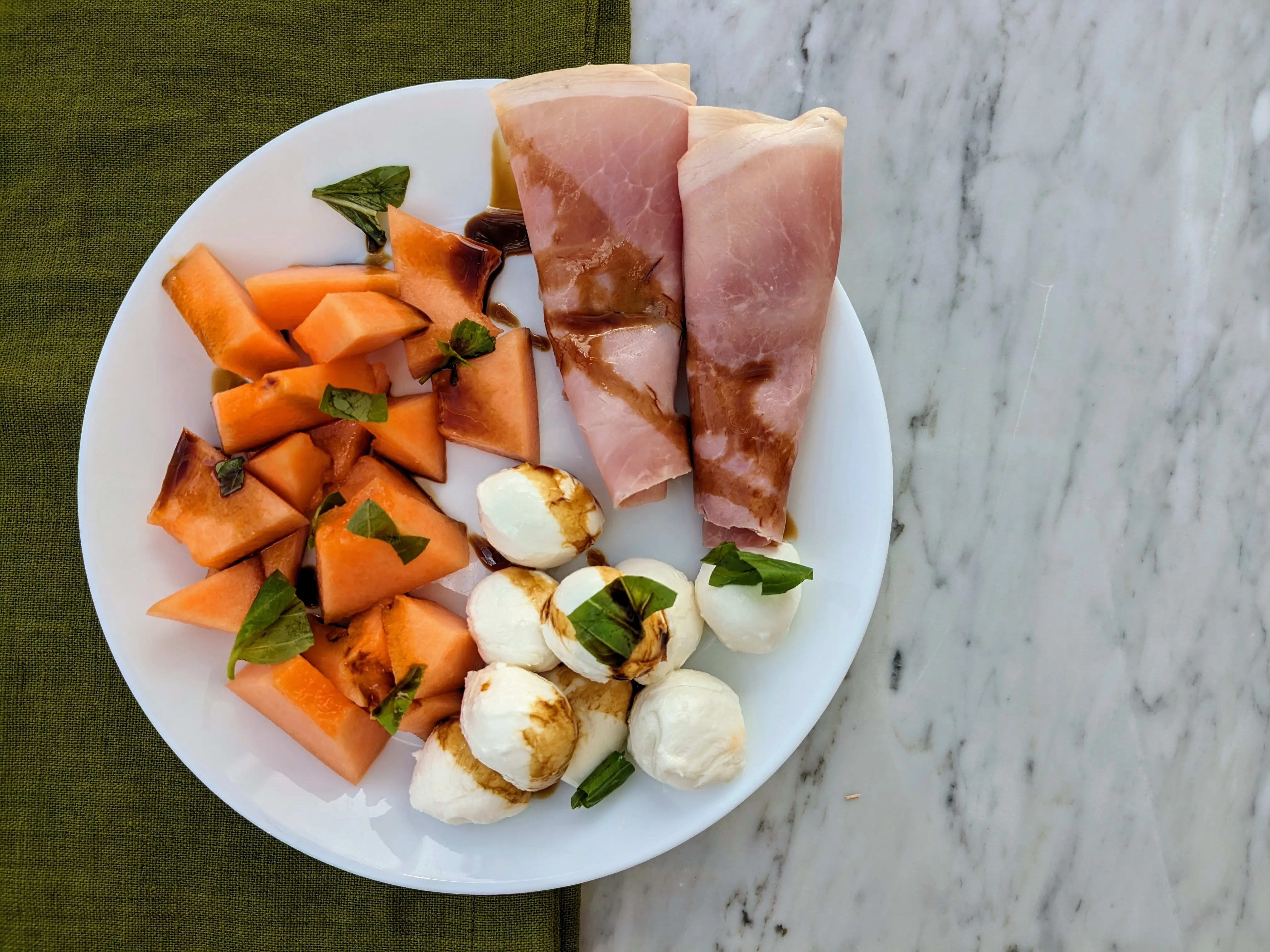 Photo of Melon with prosciutto cotto and mini mozzarella