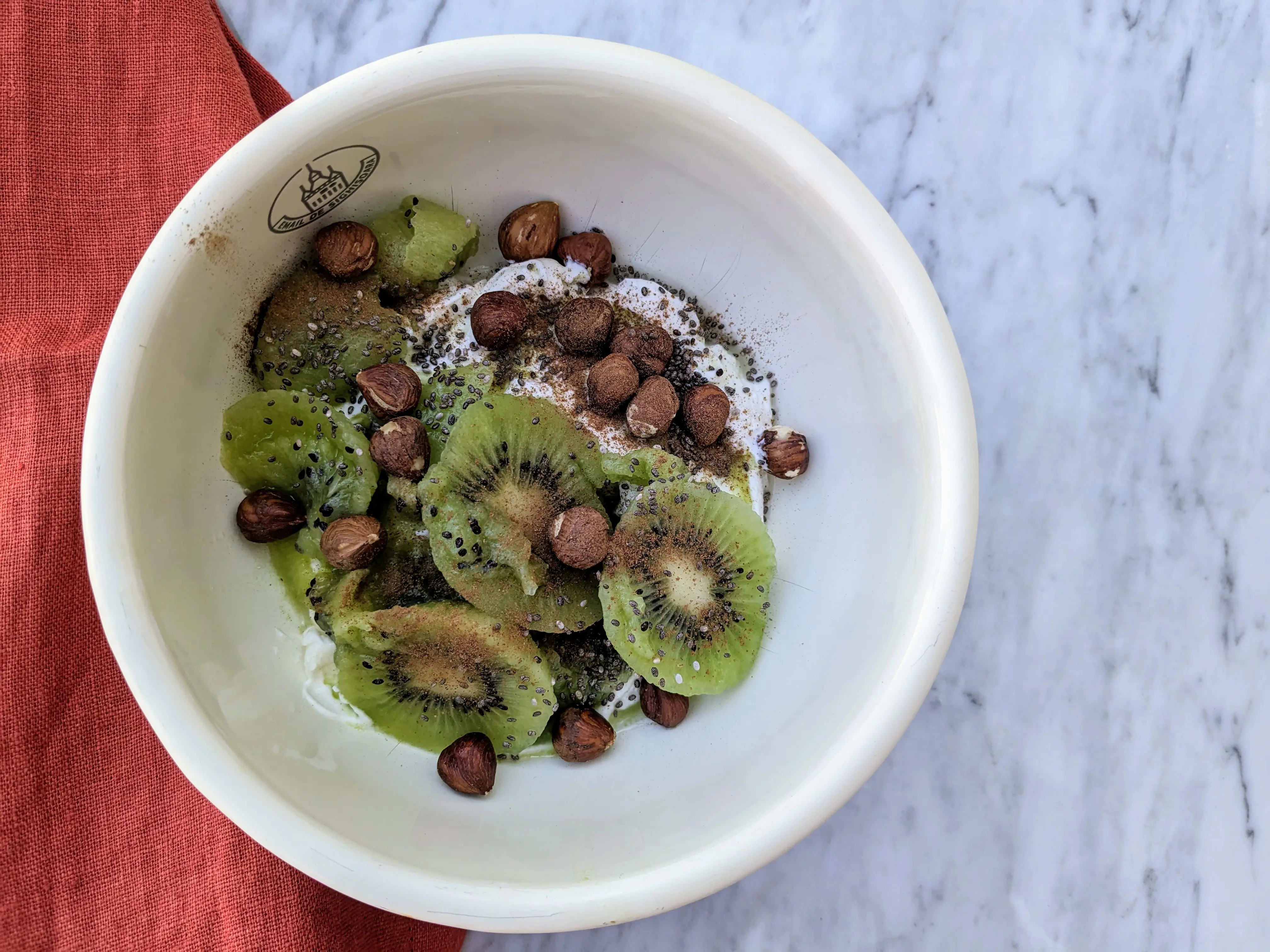 Photo of Greek yoghurt with kiwi and hazelnuts