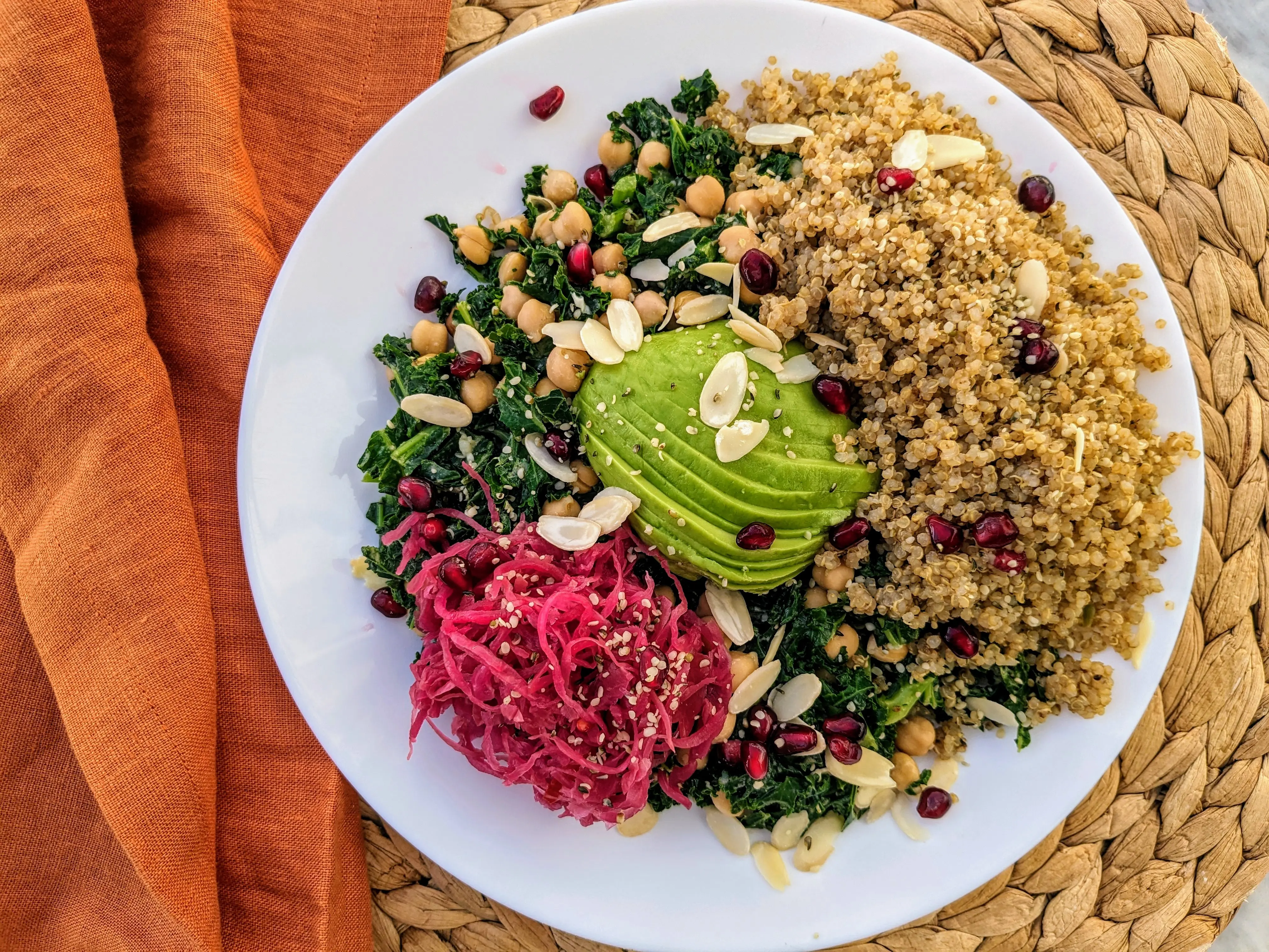 Vegan kale salad with chickpeas, quinoa and avocado