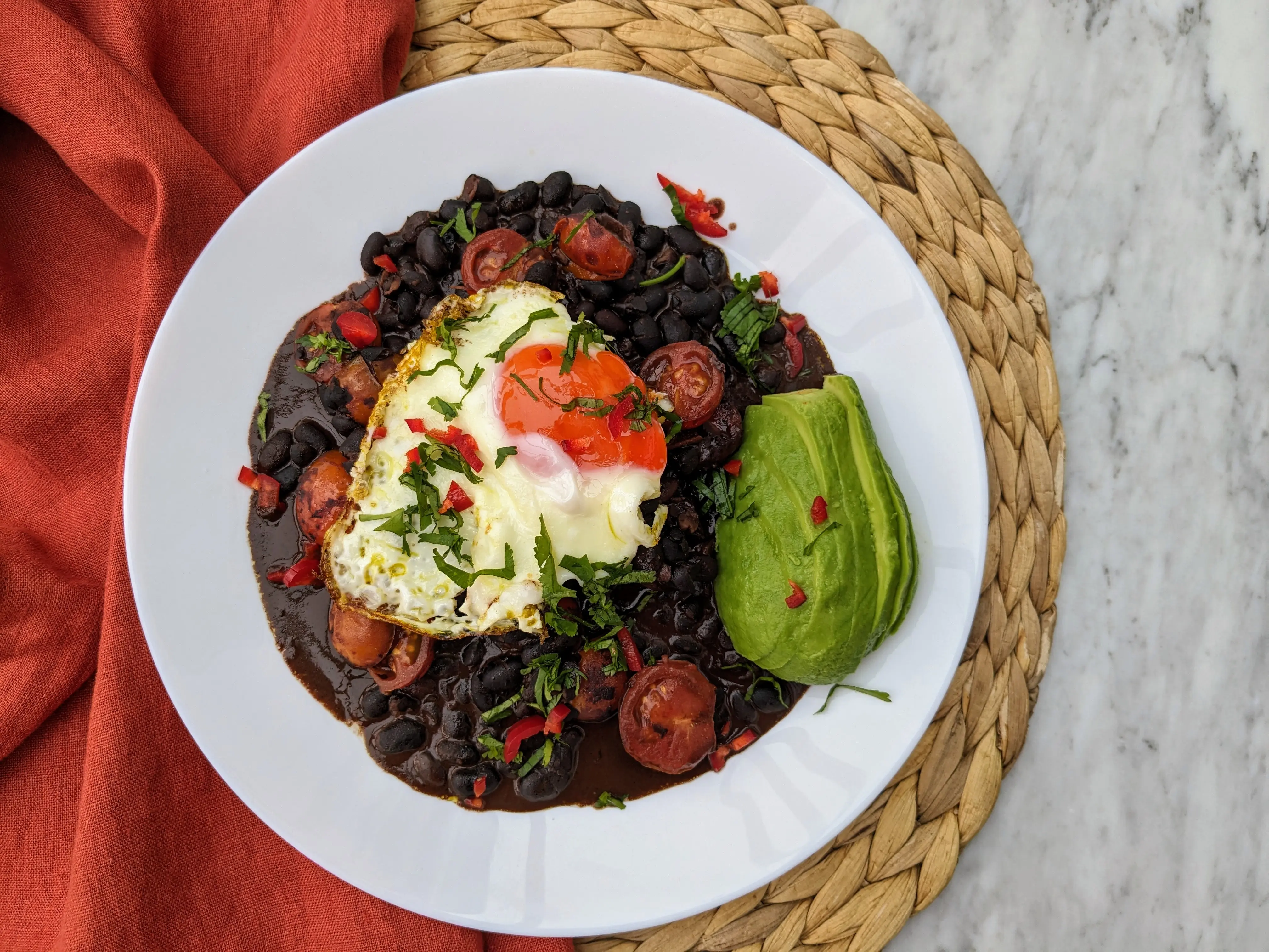 Mexican breakfast with beans, avocado and egg