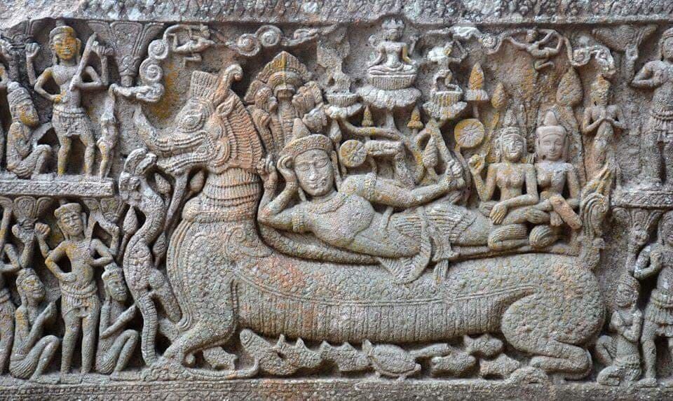 A detailed stone carving of a Makara on a temple lintel, showcasing its elephant trunk and crocodile-like mouth.