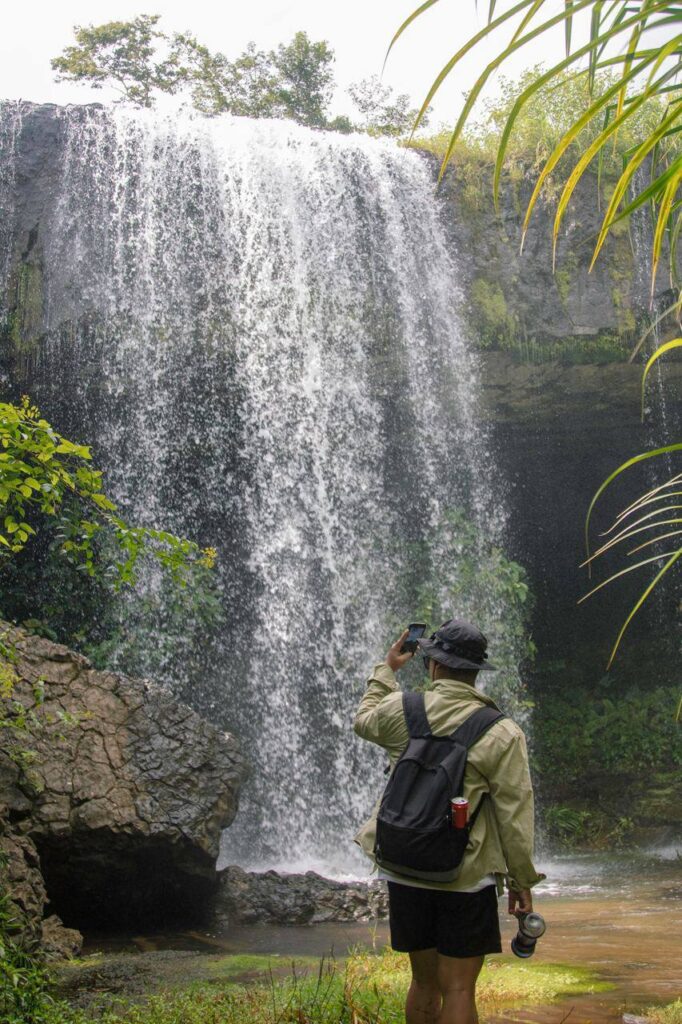 A hidden waterfall in the heart of the Cardamom Mountains with crystal clear water.