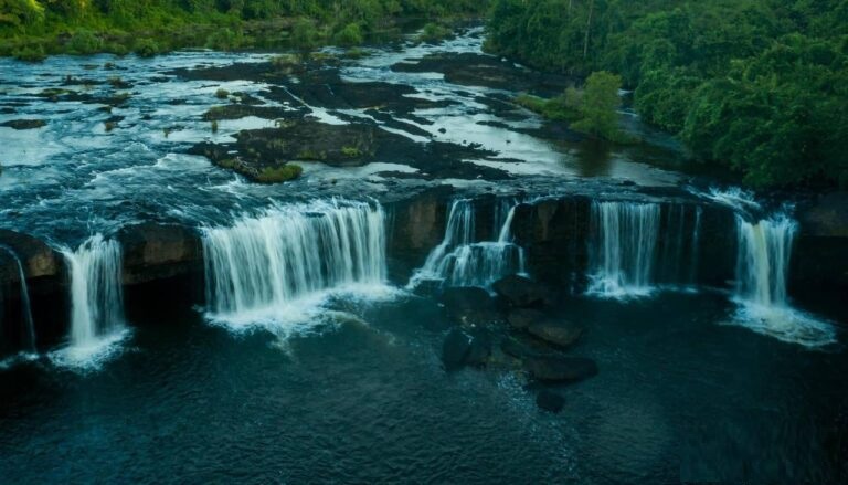 A hidden waterfall in the heart of the Cardamom Mountains with crystal clear water.