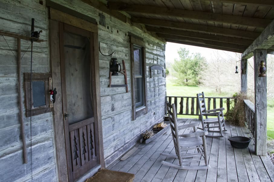 The cabin porch with rocking chairs