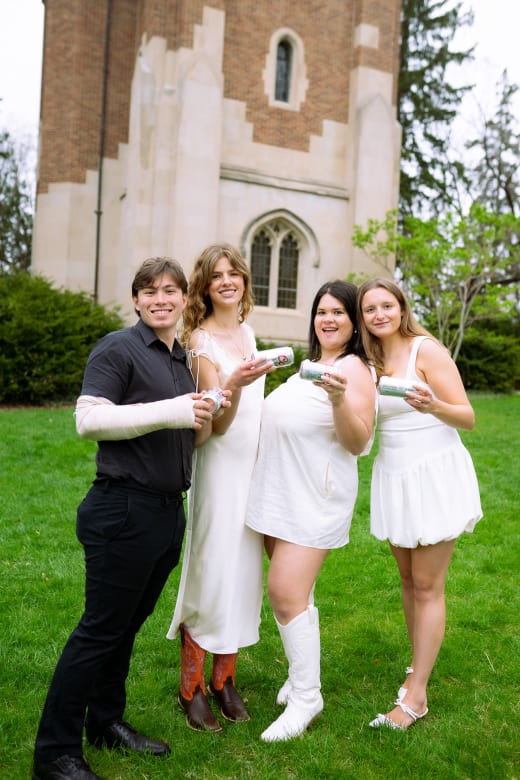 Graduates celebrating with champagne
