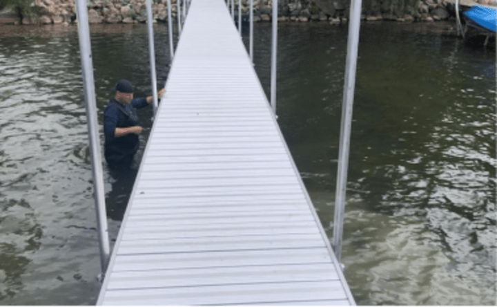 Long aluminum pier being installed