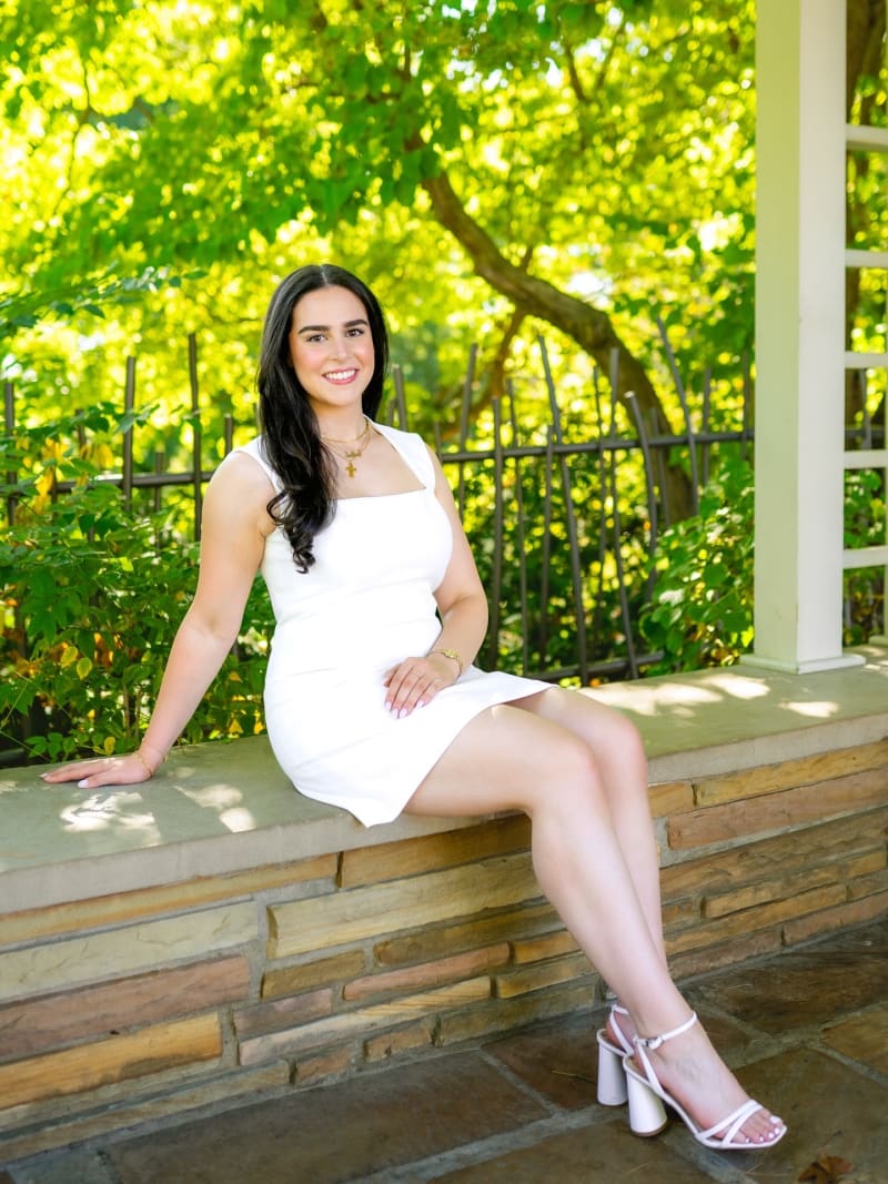 MSU graduate in a white dress
