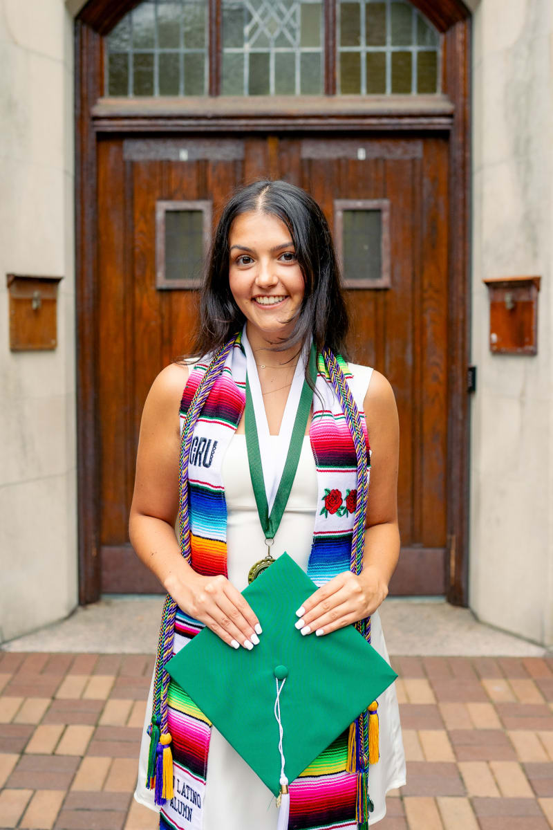 MSU graduate with a vibrant serape stole
