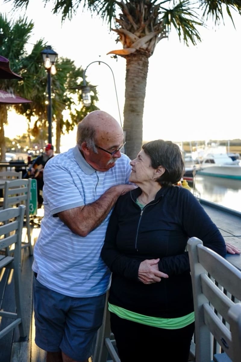 Couple laughing together at the marina