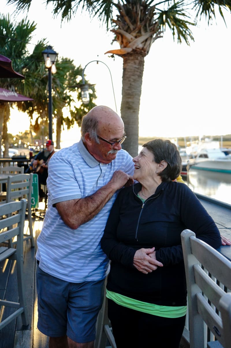 Couple laughing together outdoors