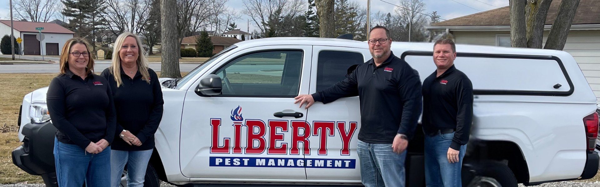 The Liberty Pest Management team with their service truck