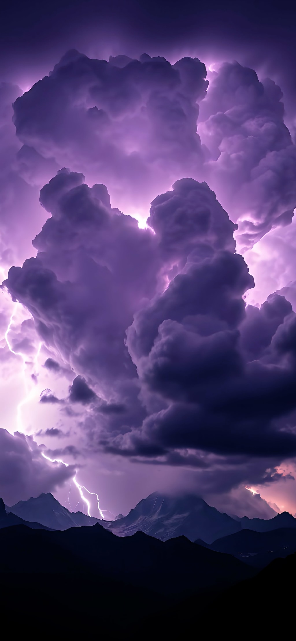 Dramatic purple storm clouds illuminated by lightning above silhouetted mountain peaks at dusk