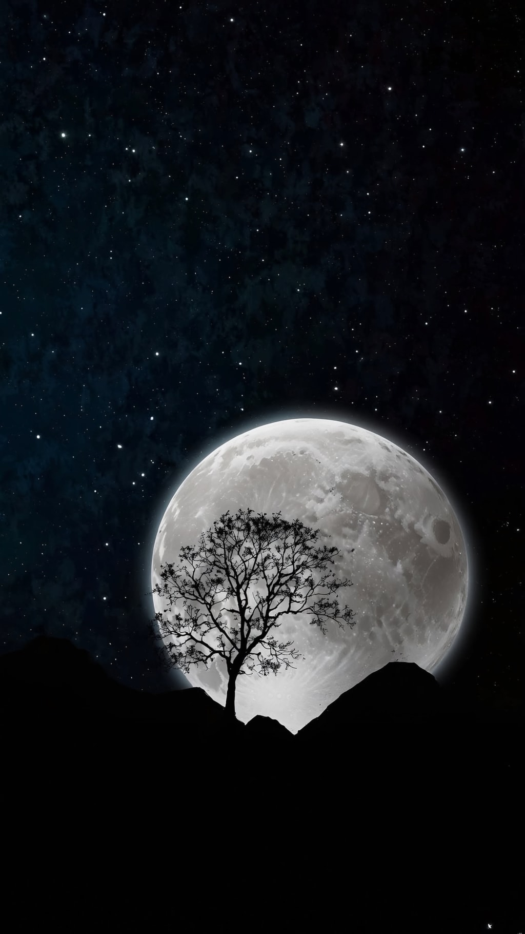 Full moon glowing brightly in dark starry sky with bare tree silhouette in foreground against lunar surface backdrop