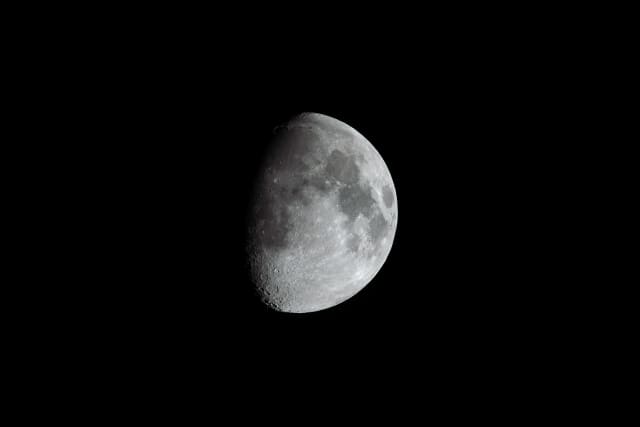 Moon Half Illuminated Dark Sky