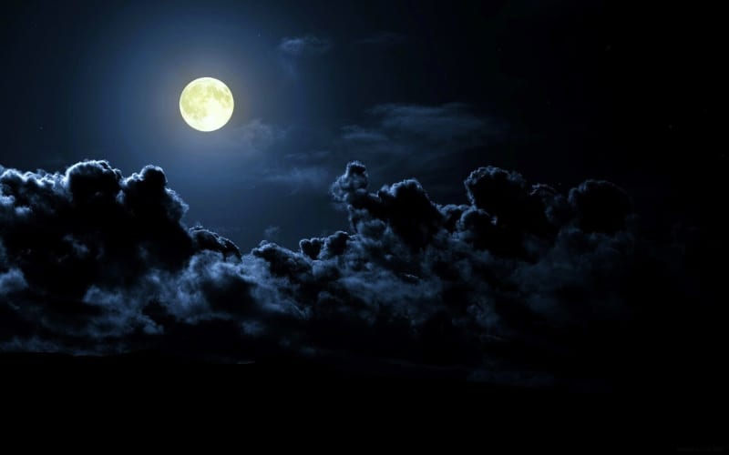 Moon Over Dark Stormy Clouds