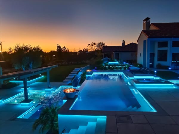 Chelshire Estates – twilight pool with fire bowls and sunset