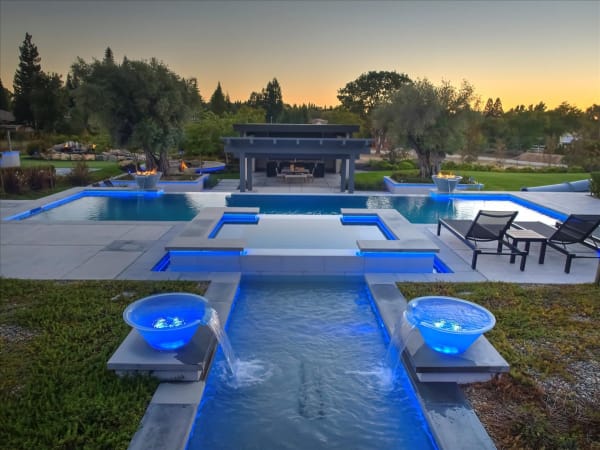 Chelshire Estates – dusk view along water feature to cabana