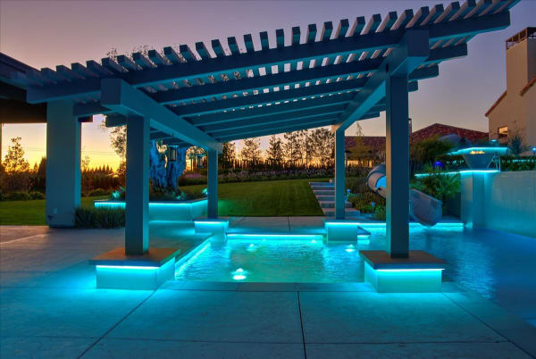 Chelshire Estates – night view through pergola with blue LED