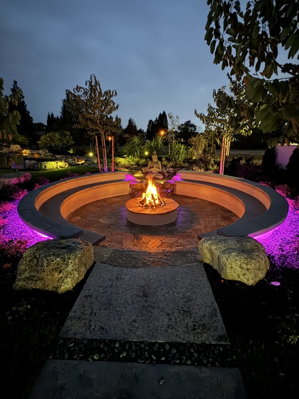 Call Residence – circular fire pit with purple lighting