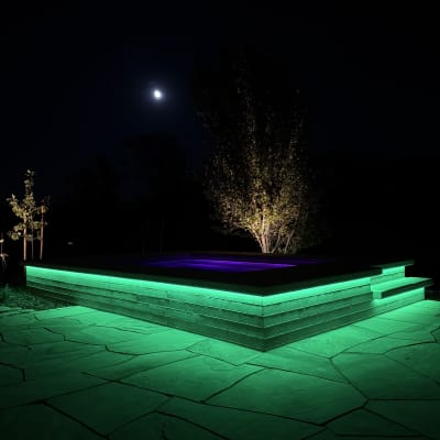 Green strip lit spa at night