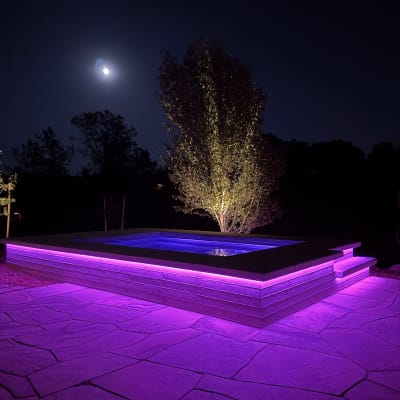 Purple strip lit spa at night