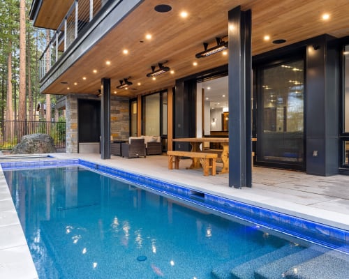Covered pool with architectural lighting