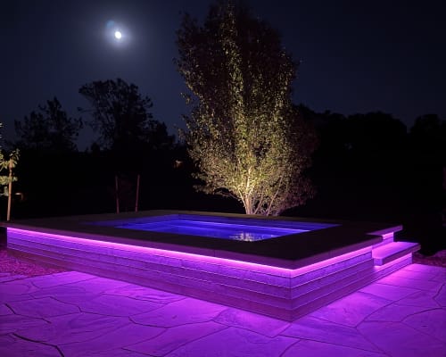 Purple strip lit spa at night