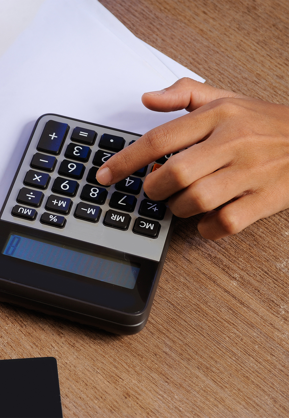 A woman making an online deposit using a card, displayed on a secure payment form