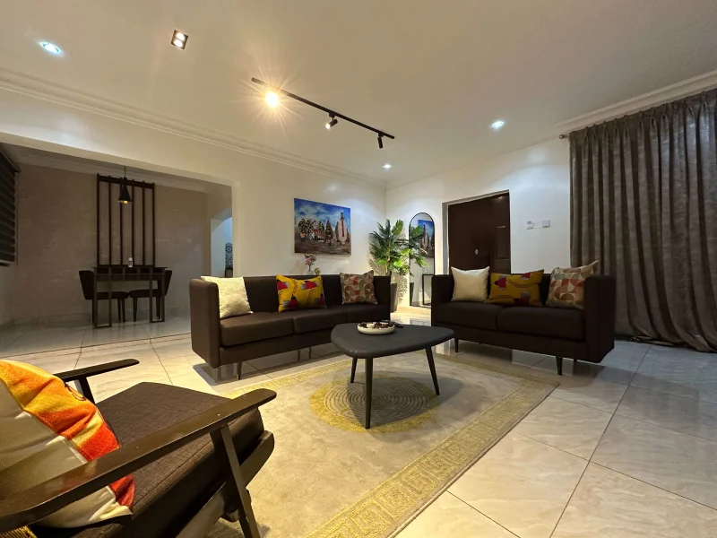 1 Bedroom Premium Suite at Aurora Smart Residence Abuja - spacious living room with modern furniture