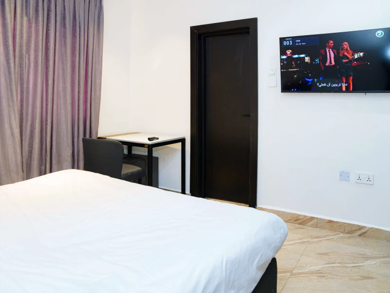 Executive Single Room at Aurora Smart Residence Abuja - spacious living room with modern furniture
