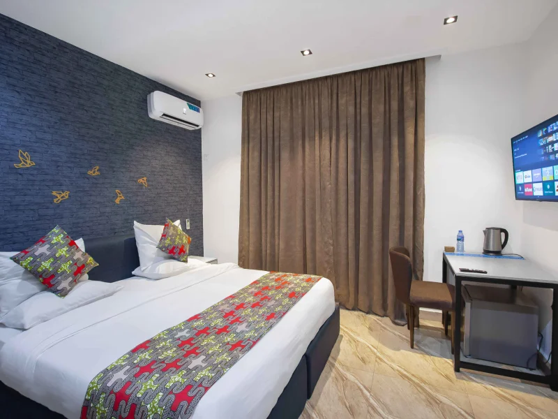 Delta Suite at Aurora Smart Residence Abuja - spacious living room with modern furniture