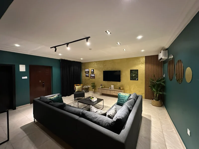 Plateau Luxury Suite at Aurora Smart Residence Abuja - spacious living room with modern furniture