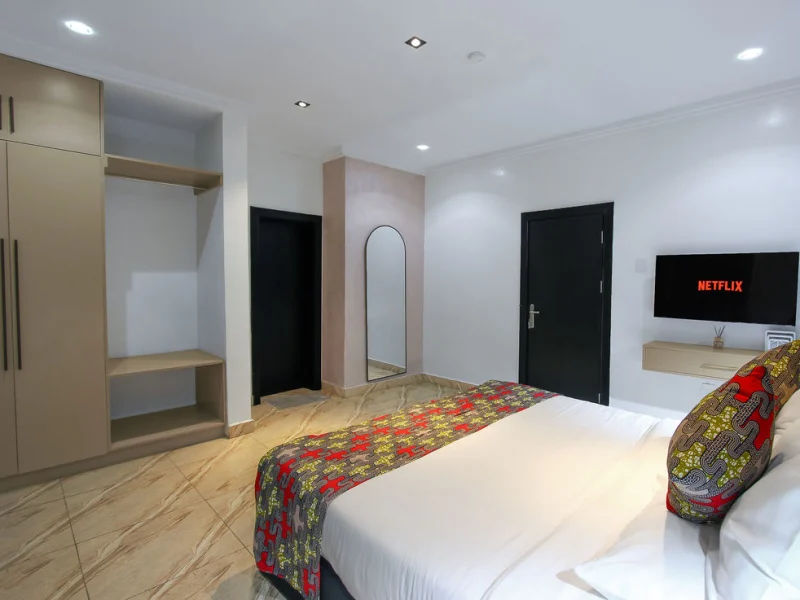 Edo Luxury Suite at Aurora Smart Residence Abuja - spacious living room with modern furniture