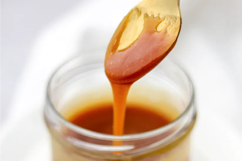 Caramel sauce on a spoon