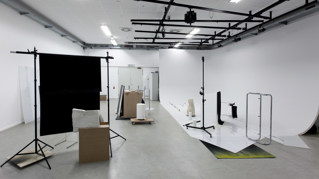 Ruta Butkute, Rijksakademie open studios/ November 2014
The title of the work, Pike: Straddle: Tuck, is in a sense a ready-made that outside its usual context of acrobatics acquires the quality of autonomous sound.
Sculptural/video installation installed in artificial light studio R1, the attributes from the space as tripods, screens integrated as a part of the installation.

Some of the sculptures are ceramic forms devoid of any use or reference. They have been combined with ready-mades that have been transformed and stripped of meaning through an adaptation as minimal as possible. In ‘sculptural videos’ showing repetitive, almost hypnotic actions the everyday object
comes alive as a performer.